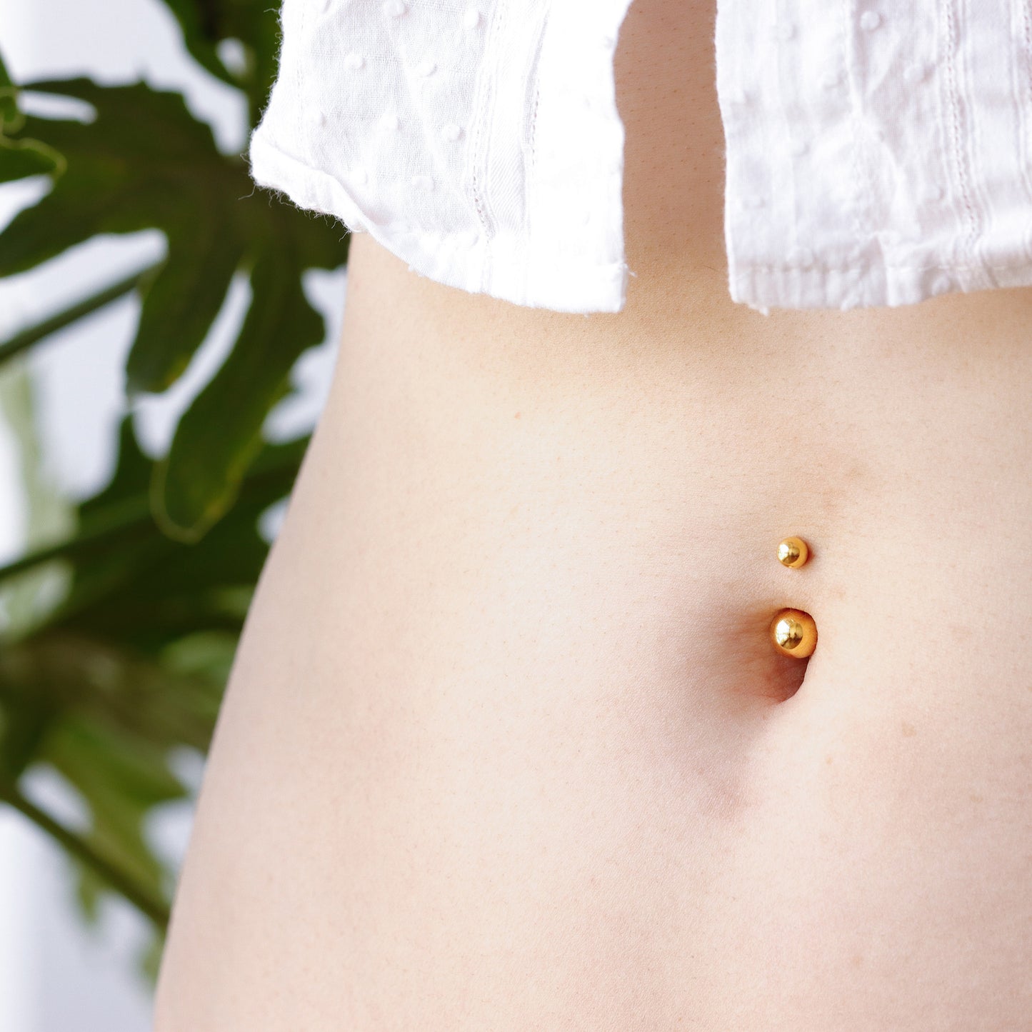 classic gold belly button piercing