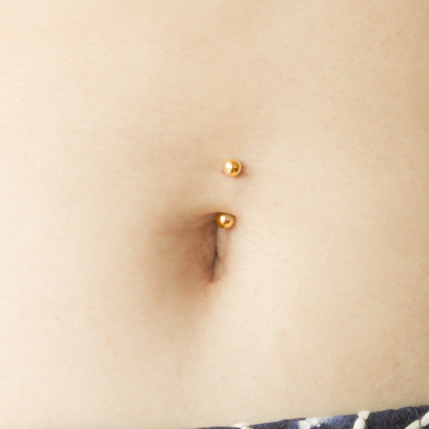 gold belly button ring