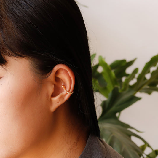 gold conch hoop earring