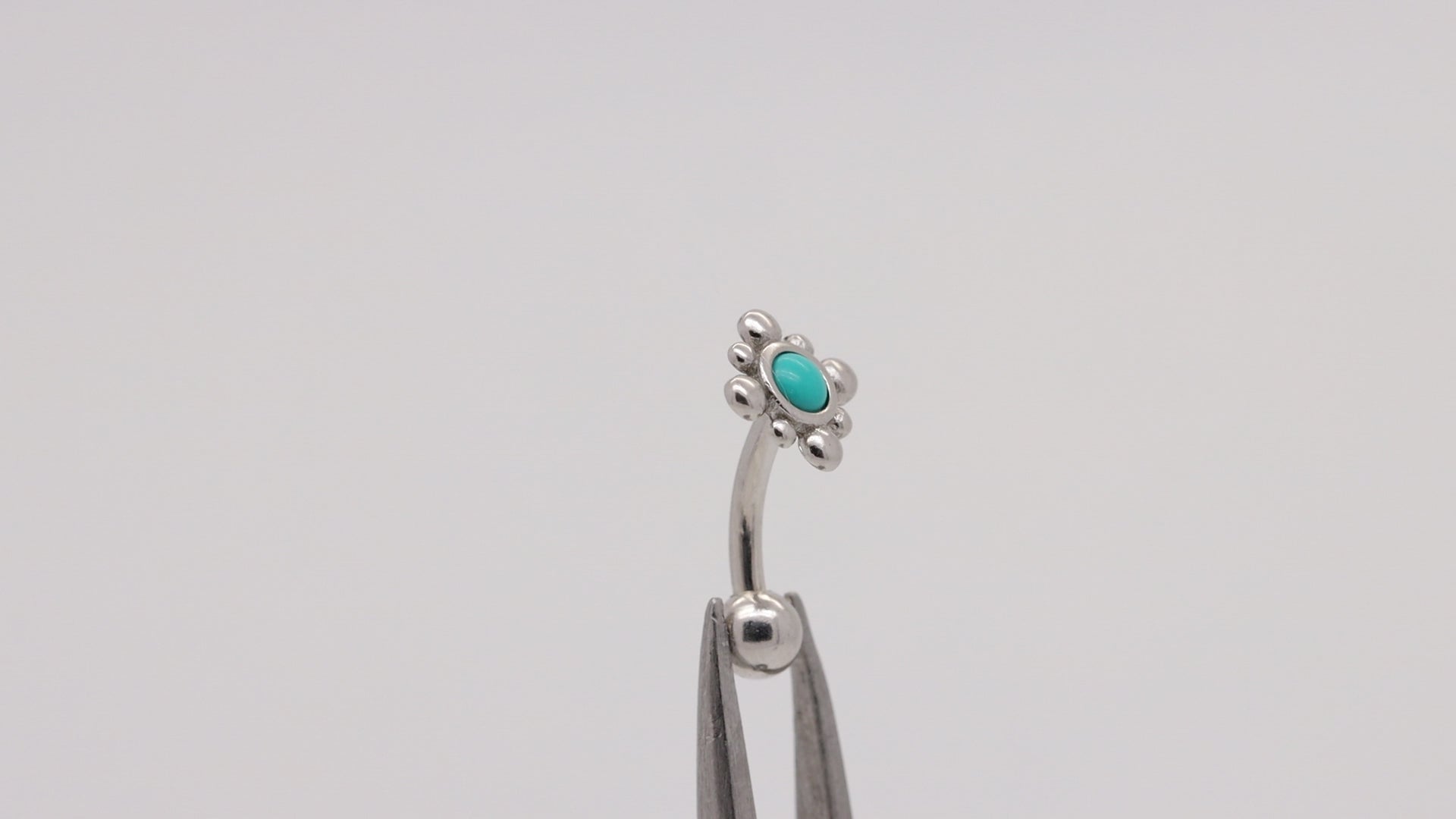 blue reverse belly button ring