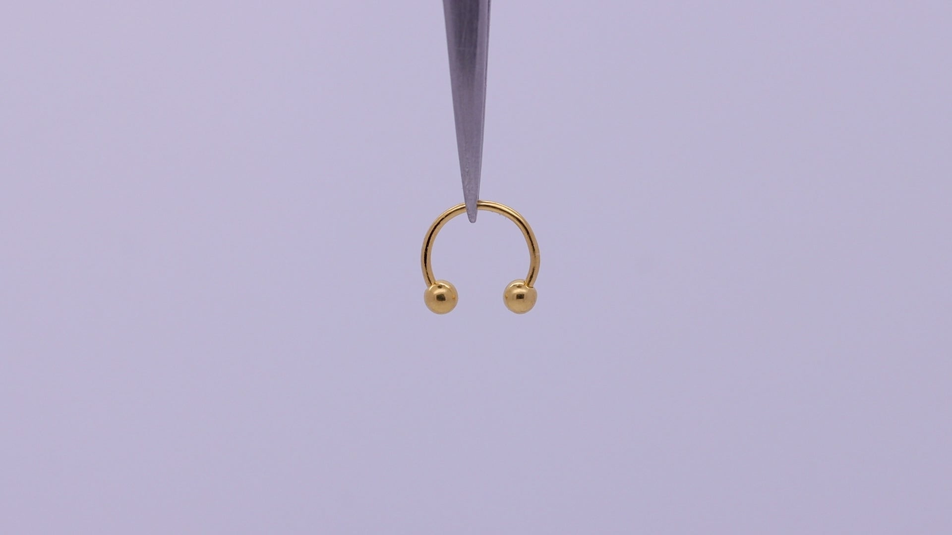19g gold septum piercing