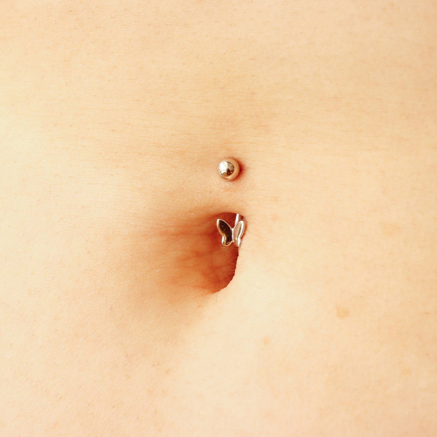 butterfly silver belly button piercing