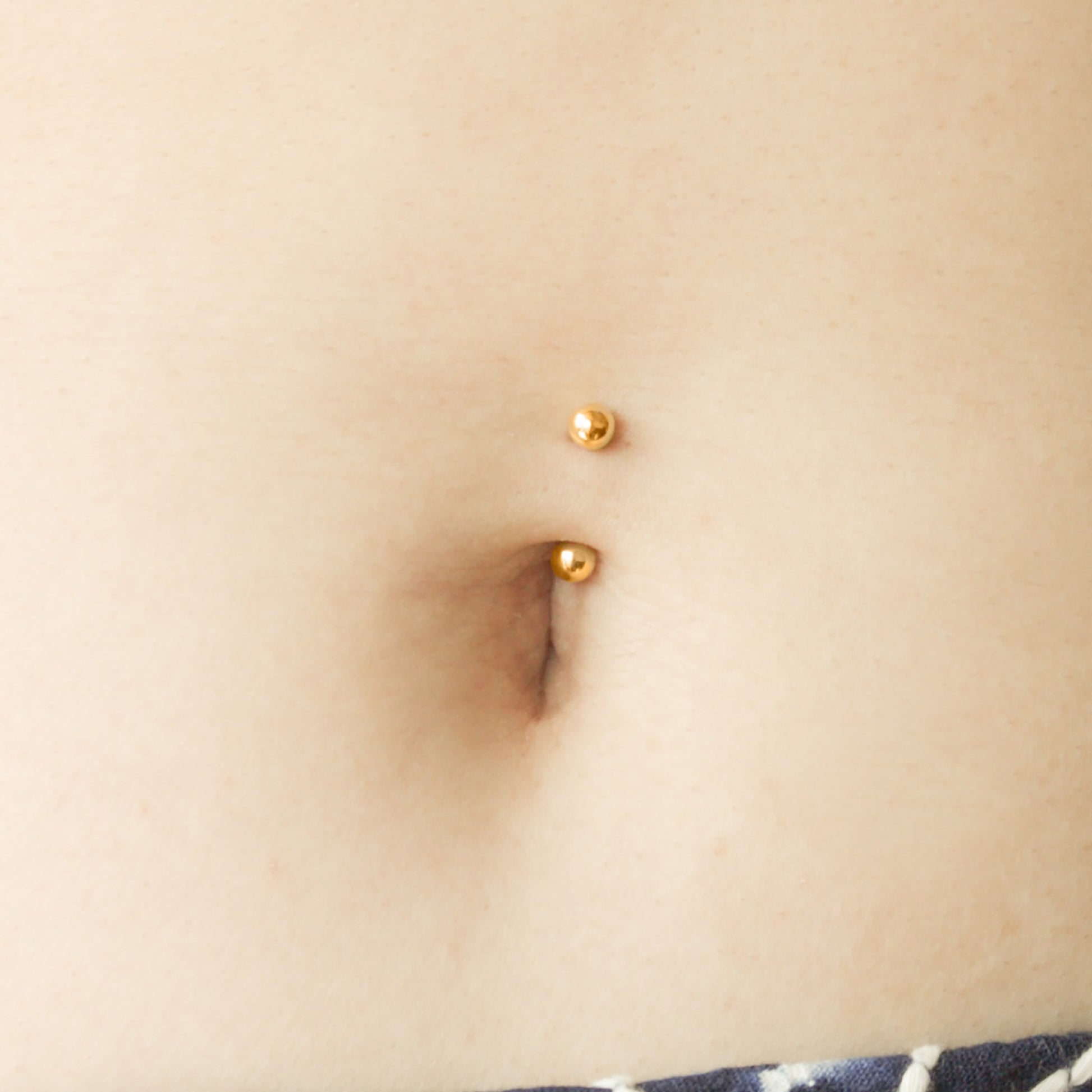 gold belly button ring