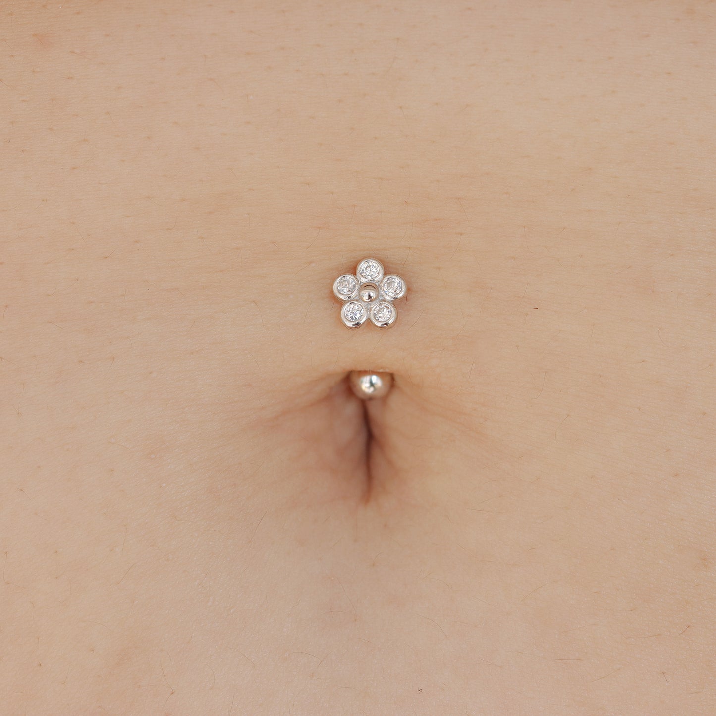 flower reverse belly button piercing