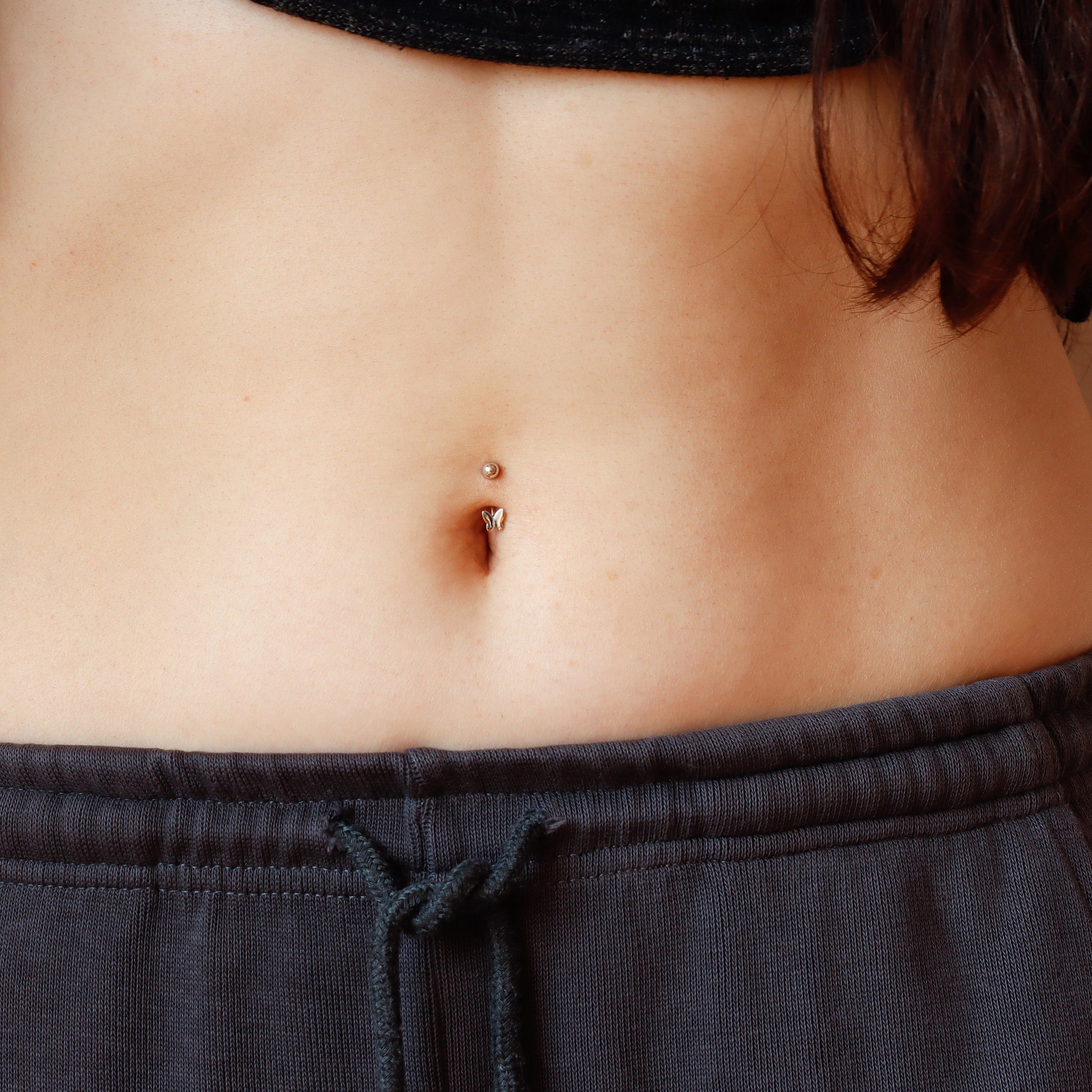 mini butterfly belly button piercing
