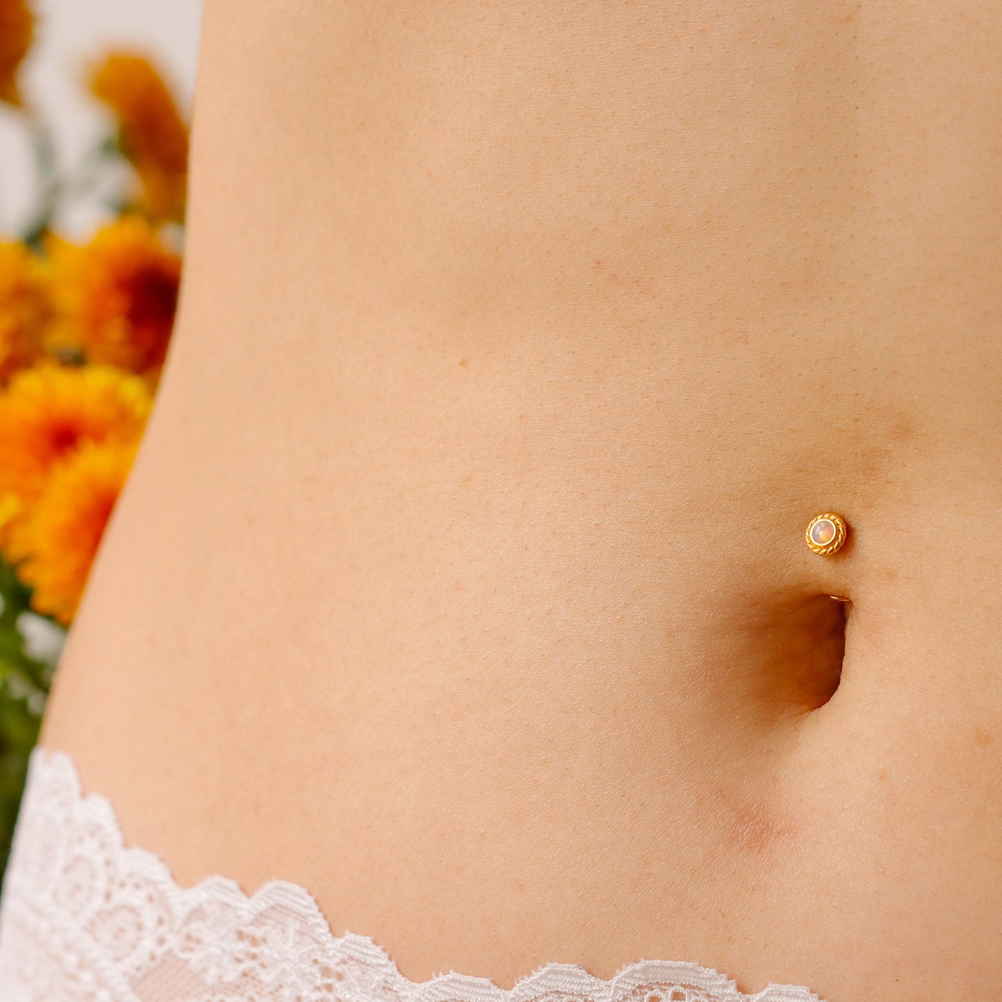 pink floating belly button ring