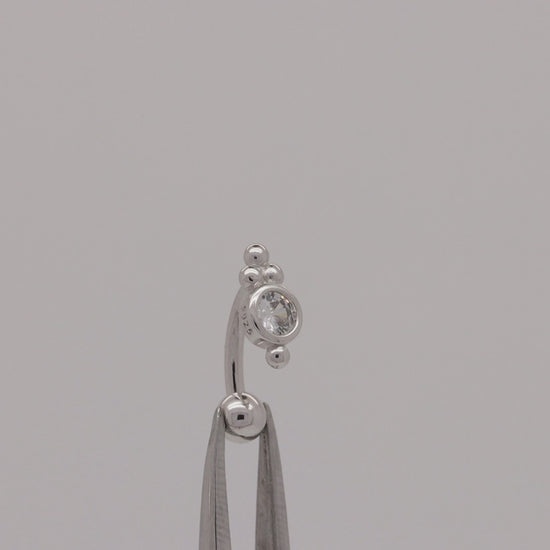 Video of a dainty sterling silver belly ring with a trinity ball design and screw-on bead.